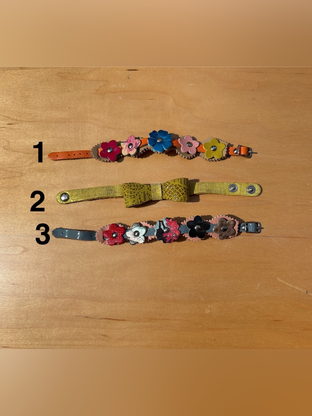Soft Leather flowers & bow bracelets handmade in Italy. $35 each. NWOT.